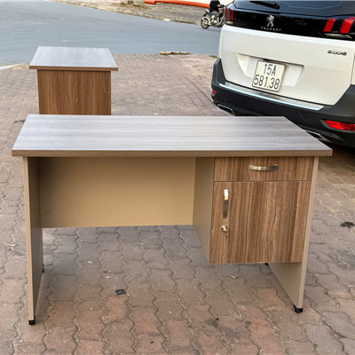 Bàn làm việc mã TP-AT120SHL  văn phòng gỗ công nghiệp hộc treo 1 ngăn  kéo 1 cánh mở màu óc chó cải